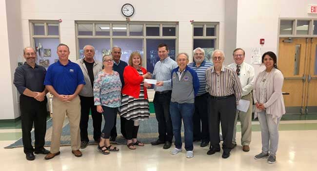 Mark Dilling, Midwest Furniture Club turning over check for $7,6oo to Dr. Deborah Trude-Suter of the Bell Montessori School. Also present was Club President Allen Landau, Kirk Handley, Jerry Divincen, Arthur Serck,  Marty Sobel, Ted Weisbach, Ron Edelman and Jeff Shapiro.