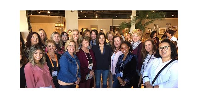 Some of Decorating Den Interiors designers meeting with TV celebrity designer Hilary Farr (center) in Braxton Culler’s showroom in 2019.
