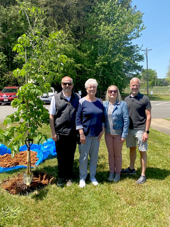 ictured left to right: Conrad Kerley, Jean Morgan, and Craig Young. Employees came together to plant a Dogwood tree in honor of Jean Morgan, who retired at after 43 years with the company.