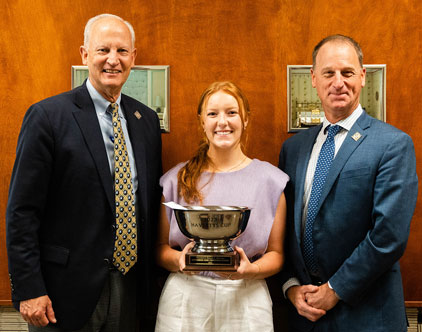 From left, Steve Burdette, president of Havertys Furniture, with HPU senior and Havertys Cup recipient Hannah Robertson and Scott T. Miles, senior vice president of stores for Havertys Furniture. 