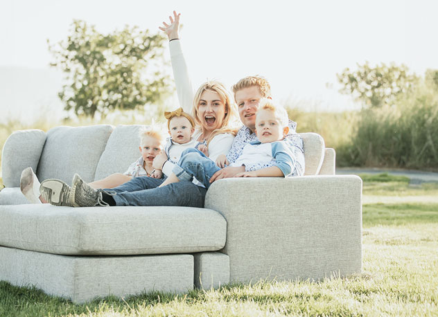 Bailee Nebeker with husband Nathan Chetrit and family on the self-designed and sourced Vincent sectional, named after the small gentleman on the right.