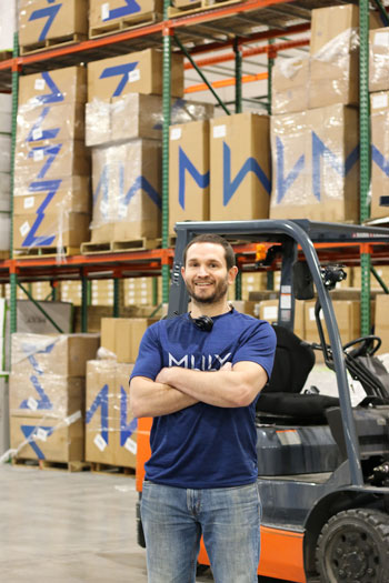 An MLILY warehouse employee.