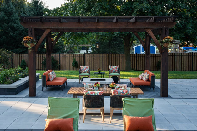 A patio space featured on Holmes on Homes: Building a Legacy that has been redesigned with SUNPAN’s outdoor furniture.